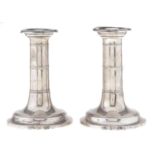 A pair of Scottish Edward VII silver dwarf candlesticks, with reeded bands, nozzles, 12cm h, by