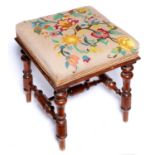 A Victorian mahogany upholstered stool, c1860, the square top stuffed over in floral gros point on