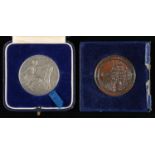 A frosted silver amateur gardening prize medal, 40mm, London 1933, 28g, cased and a bronze medal,