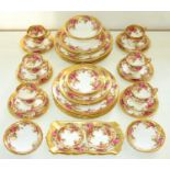 A Royal Chelsea bona china Golden Rose pattern dinner service, late 20th c, printed mark (42) One