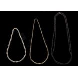 Three cultured pearl and faux pearl necklaces, each with gold clasp marked 14k Good condition