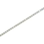 A diamond bracelet, set with a line of evenly sized round brilliant cut diamonds, in white gold,