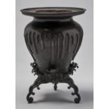 A Japanese bronze vase and stand, by Kimura Toun, Meiji period, the vase cast to resemble lava