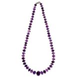 A necklace of faceted amethyst beads, 57cm l, 85g Occasional tiny flea bite type chips