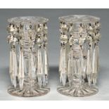 A pair of Victorian cut glass lustre candlesticks, late 19th c, hung with prismatic cut beads and