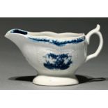 A Worcester blue and white sauceboat, c1765, strap fluted and painted with a version of the