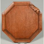 A Robert 'Mouseman' Thompson octagonal oak cheeseboard, second half 20th c, 20.5cm, carved mouse '