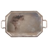 A George V silver tea tray, cut cornered with moulded border, 66cm over handles, by Hawksworth, Eyre