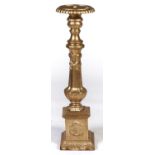 A cast iron pricket candlestick, in 16th c Italian style, 102cm h Gold painted at a recent period,