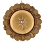 A Victorian round gold mourning brooch, with scalloped edge, the dished centre gipsy set with rose