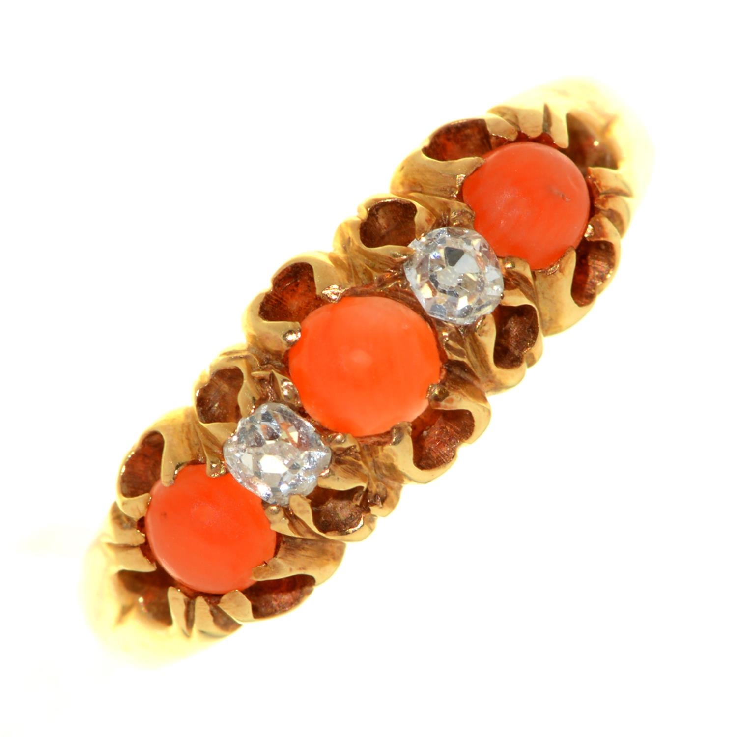 A coral and diamond ring, early 20th c, in 18ct gold, marks rubbed, 3.2g, size M All stones