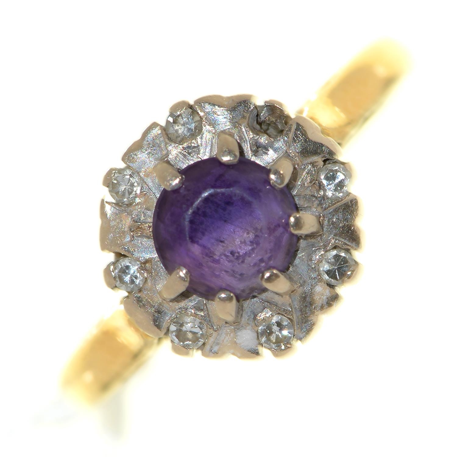 An amethyst and diamond cluster ring, in 18ct gold, Birmingham 1970, 3.8g, size L½ Amethyst with