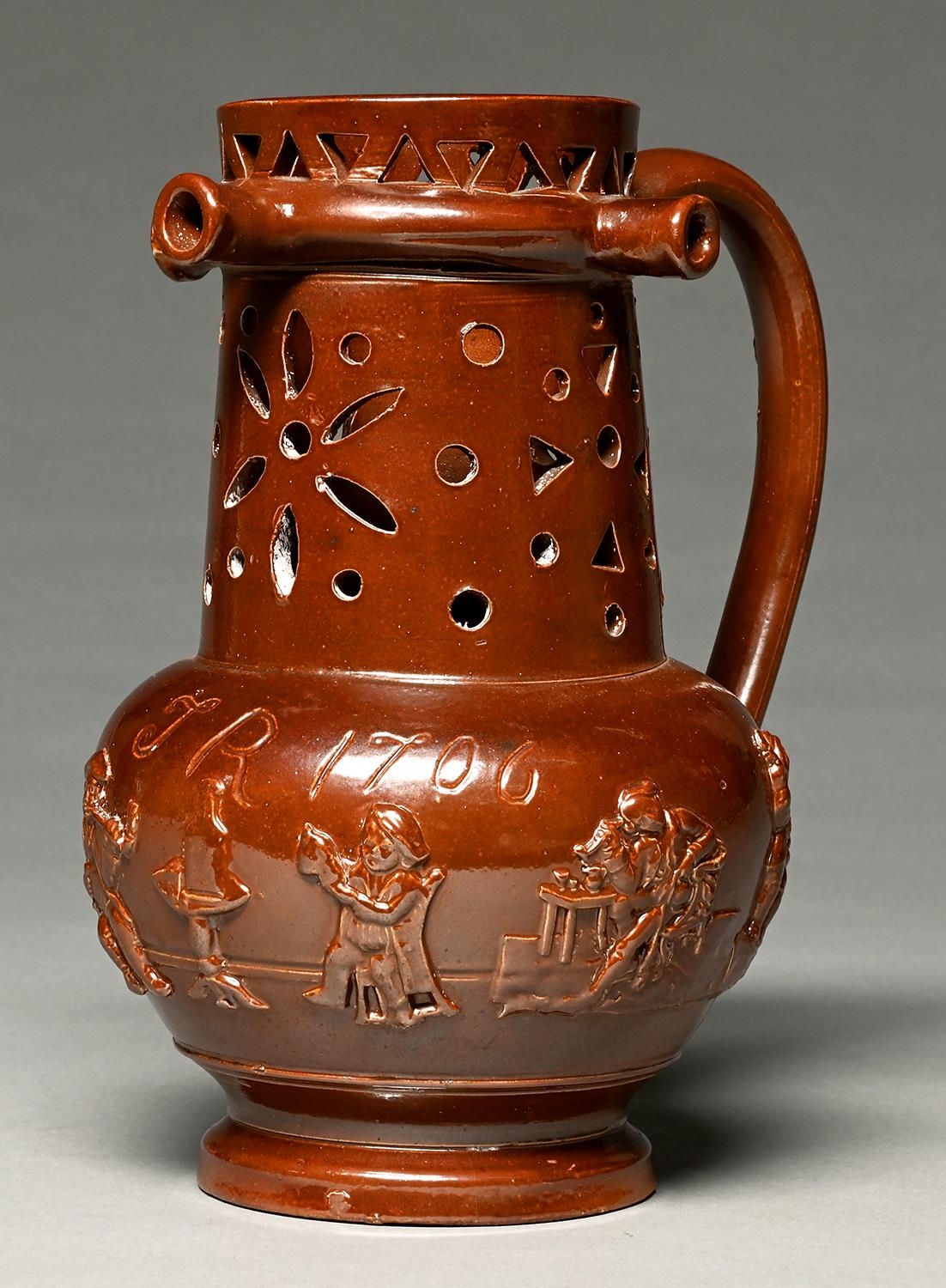 An English saltglazed brown stoneware puzzle jug, Derbyshire or Nottinghamshire, second quarter 19th