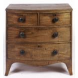 A Regency mahogany bow front chest of drawers, the top applied moulded lip, fitted two short and two