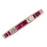 A synthetic ruby and white sapphire eternity ring, gold mount marked 9ct, 1.9g, size R Mount with