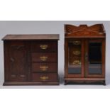 Two Edwardian oak smoker's cabinets, one with fitted interior and enclosed by a pair of doors with