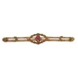 A red paste bar brooch, in gold marked 10k, 3g Good condition