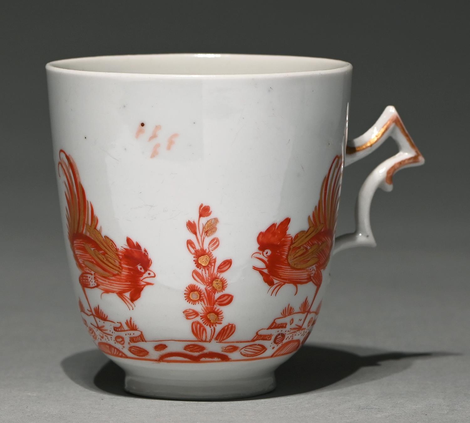 A Doccia coffee cup, late 18th c,  painted in red enamel and gilt, with fighting cocks ('a