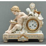 A Meissen clock case, late 19th c, the drum cased movement surmounted by a pillar, laurels, bust and