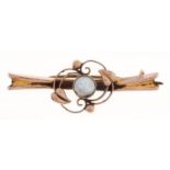 A blister pearl bar brooch, in gold of scrolling design marked 9ct, 1.8g Much dirt but good