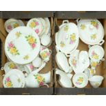A Staffordshire bone china pink and yellow rose decorated dinner service