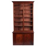 A Victorian mahogany bookcase, late 19th c, fitted with adjustable shelves, the upper part