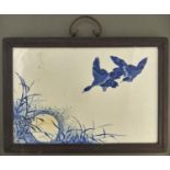 A Chinese blue and white plaque, painted with geese and bamboo, 24 x 36cm, framed Good condition
