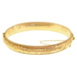 A 9ct gold bangle, 63mm, Birmingham 1968, 13.5g Shallow dent in one place but no signs of wear