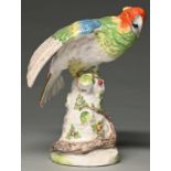 A French porcelain model of a parrot, Achille Bloch, c1900,  brightly painted and perched on a stump