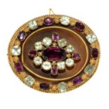 A Victorian garnet and chrysoprase brooch, c1870, in gold, locket back 44mm, 18g Central embossed