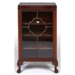A mahogany display cabinet, early 20th c, the rectangular top with figured frieze centred on a blind