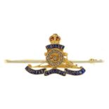 A diamond and gold and enamel royal artillery sweetheart's brooch, c1930, 51mm, marked 15ct PT, 5.4g