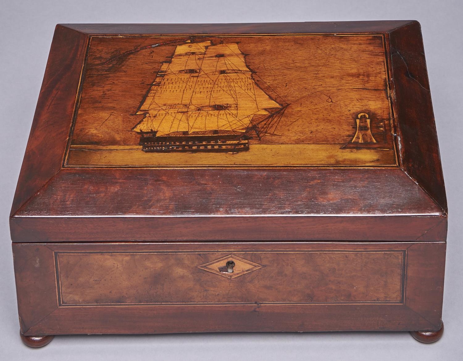 A sailor's mahogany, walnut, inlaid and penwork decorated workbox, late 19th c, the lid with a