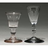 An English wine glass, c1785, the round funnel bowl engraved with polished swags, on faceted stem