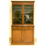 An Edwardian Sheraton revival bookcase-cabinet, early 20th c, outlined throughout with satinwood