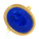 A lapis lazuli oval cabochon ring, in gold marked 750, 4.5g, size O Stone of good polish; gold in