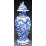 A Chinese blue and white vase and cover, 19th c, painted with a man and ox crossing a bridge over
