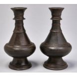A pair of Indian brass vases, possibly 18th c, brown patina, 23cm h Good conditon
