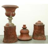 A pair of Victorian terracotta garden vases and rustic pedestals, late 19th c, the campana vase with