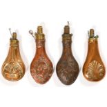 Three Victorian brass or copper powder flasks and another, various sizes Minor dents, light wear and