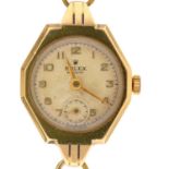 A Rolex 9ct gold octagonal lady's wristwatch, Precision, on corded bracelet, 23 x 21mm, Chester 1950