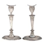 A pair of Scottish Edwardian silver candlesticks, in neo classical style, nozzles, 20cm h, by