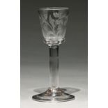 An English wine glass, c1750, the bucket bowl engraved with lily of the valley and a single