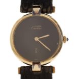 A Le Must de Cartier silver gilt lady's wristwatch, quartz movement with black dial, 24mm, maker's