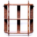 A set of Edwardian walnut hanging shelves, with fretwork pillars and pointed finials, 60cm h Good