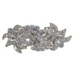 A  diamond double clip brooch, second quarter 20th c,  designed as a knot and set with round