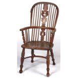 An ash and elm high back Windsor  chair, c1860, with pierced shaped splat, vertical rails, turned