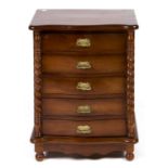 A serpentine mahogany dwarf chest of drawers, 20th c, with spiral pilasters, 67cm h; 37 x 51cm