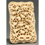 A Chinese export ivory card case, Canton, mid 19th c, the front typically carved with densely