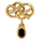 A Victorian giltmetal baton-and-knot brooch, c1870, with foiled garnet drop, 51mm Good condition